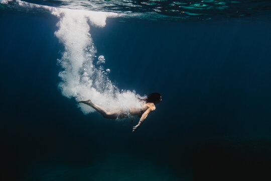 Woman diving underwater