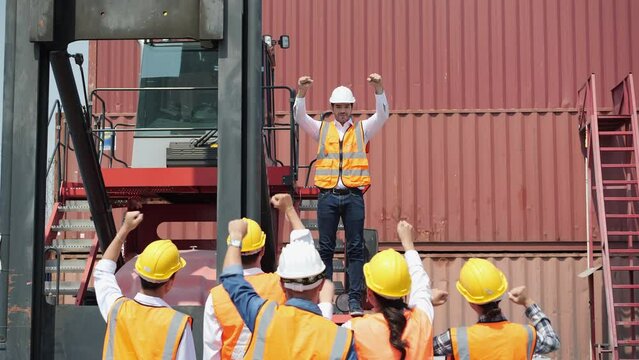 Workers gather to protest and expressed their displeasure at the cargo port with truck and container. Concept of movement, labor strike, work stoppage and revolution.