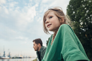 Little daughter and dad in the city