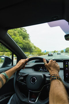 Hands on wheel on the highway