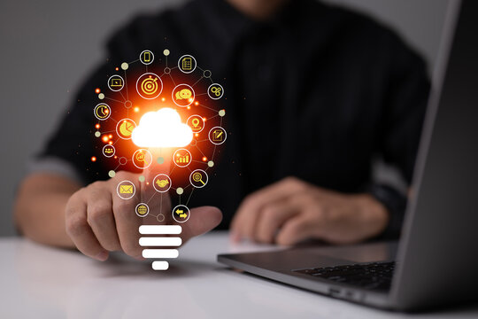 A unique light bulb with an application icon. business software and social media concepts. Business social media marketing and digital online marketing with cloud. - Powered by Adobe