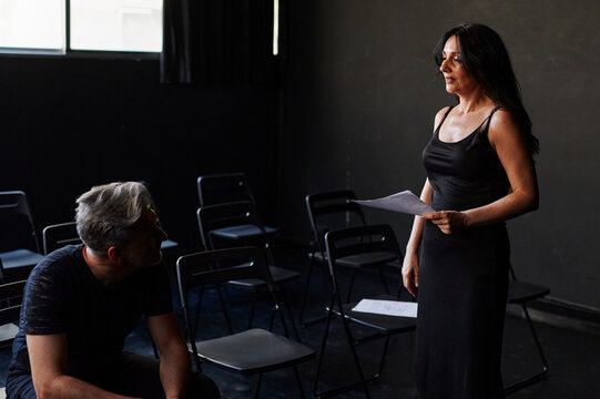 Actor and actress rehearsing lines together 