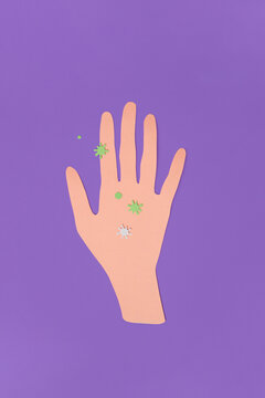 Paper craft hand with virus on violet background
