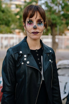 Pretty woman in a park, dressed up for Halloween.