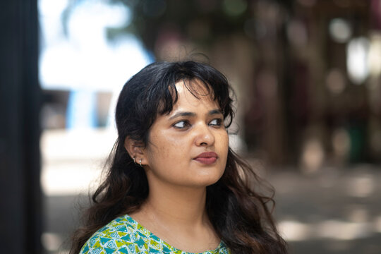 Portrait of an  young Indian woman in outdoors in a city