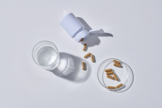 Brown vitamins and pills on a white background