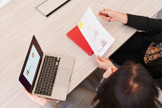 Businesspeople comparing data during a meeting