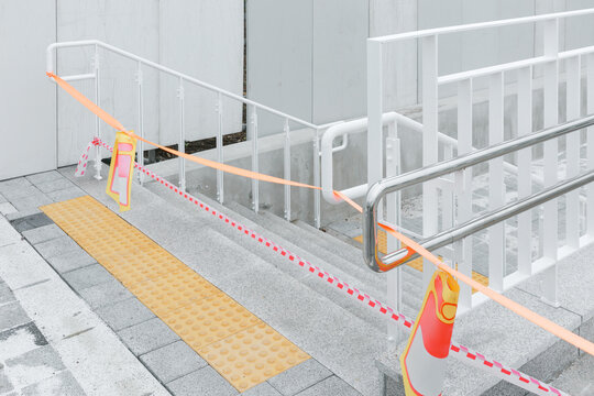 Barrier tape tied to the stairs.