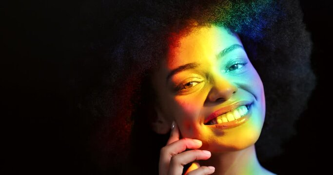 Lgbt rainbow light, black woman beauty and glowing skin, creative portrait and pride on dark background. Transgender equality, gay african person and lesbian face with freedom colors, smile and shine