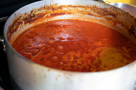Cooking handmade tomato sauce passata