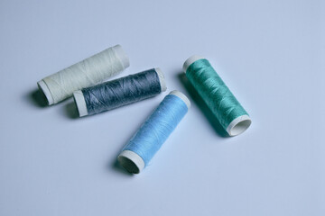 spools of  multicolored threads isolated in white background