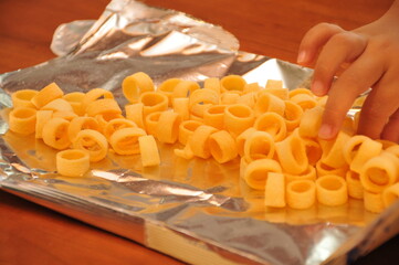 raw pasta on wooden board