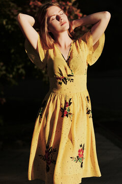 Portrait of a young woman in a yellow dress