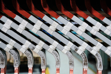 Group of colorful metal details of electric motor at plant