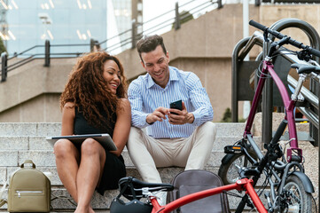 Diverse freelancers sitting on steps