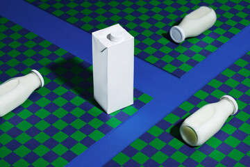 Blank lying on milk bottles and cardboard milk pack
