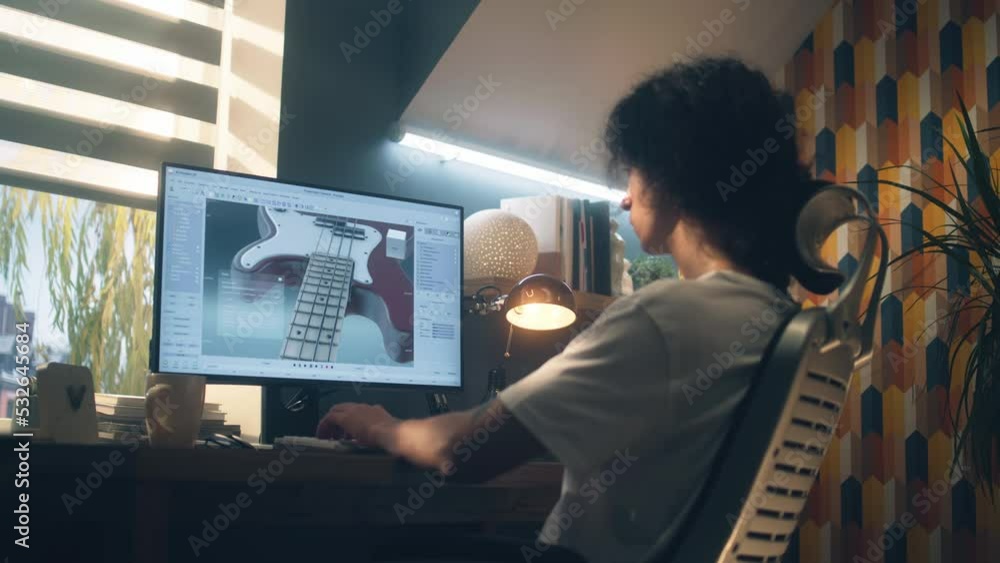 Aufkleber young guy creating 3d prototype of guitar using modern personal computer and 3d modeling program whi