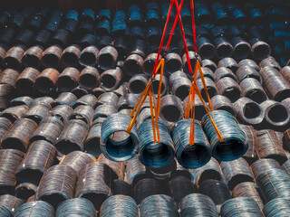 Top view of wire rods in coils stowage into cargo hold of the vessel, Discharging steel wire rod...