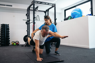 Man doing yoga in a physiotherapy clinic