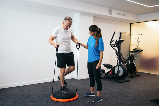 Rehabilitation Therapy In A Physical Therapy Gym.