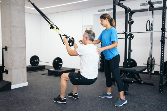 Man doing rehabilitation therapy at the physiotherapist - Powered by Adobe