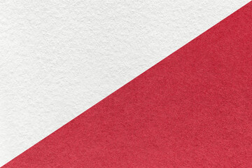 Texture of craft white and red paper background, half two colors, macro. Vintage dense kraft ruby...