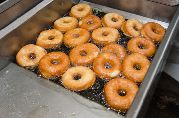 Cooking donuts in a deep fryer