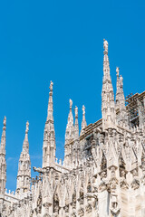 Fototapeta na wymiar Architectural details with the exterior of the Milan Duomo