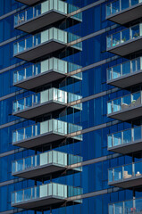 Obraz premium Blare Reflections on a Building Exterior.
