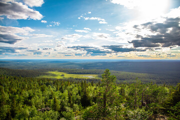 Naklejka premium Landscape view from the top of Iso-Syöte hilltop with clouds and sky, Lapland, Finland