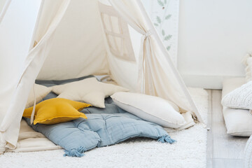 Stylish interior of children's room with hut