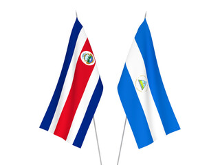 National fabric flags of Nicaragua and Republic of Costa Rica isolated on white background. 3d rendering illustration.