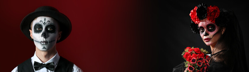 Young woman with painted skull on her face for Mexico's Day of the Dead against dark background