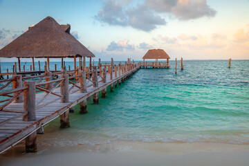 Cancun idyllic caribbean beach and gazebo Palapa at sunset, Riviera Maya, Mexico