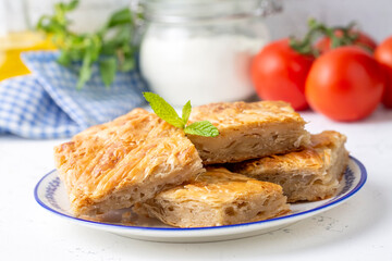 Handmade Greek spring rolls with cheese, sliced into squares. Turkish name; el yapimi tepsi boregi