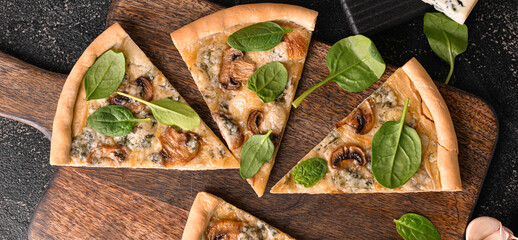 Slices of tasty pizza with mushrooms on dark background, top view