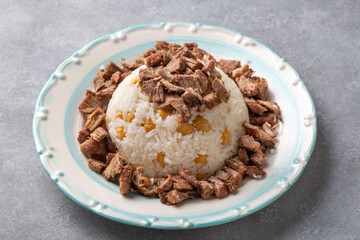 Traditional Turkish cuisine; Rice pilaf with meat and chickpeas. Turkish name; Pilav ustu et...
