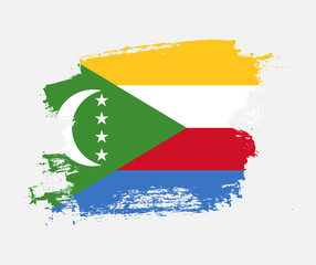 Artistic Comoros national flag design on painted brush concept
