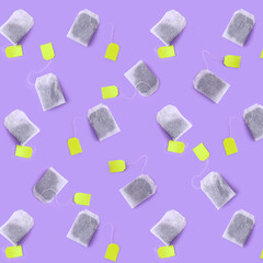 Many tea bags on lilac background. Pattern for design