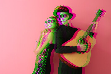 Young couple with painted skulls on faces for Mexico's Day of the Dead (El Dia de Muertos) and guitar against pink background