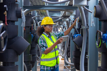 Engineer under industrial inspection Large water heaters are used in high-rise condominiums.
