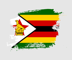 Artistic Zimbabwe national flag design on painted brush concept - obrazy, fototapety, plakaty
