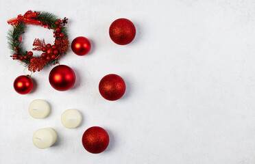 Red Christmas Balls with candles on a light background. Selective Focus. Space for copying. view from above.