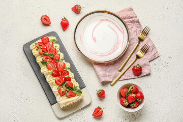 Composition with delicious strawberry roll cake and fresh berries on light background