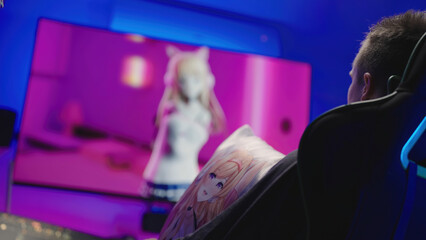 Man watch anime tv show with dakimakura hug pillow anime girl on gaming chair