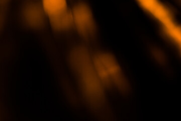 Blur colorful warm rainbow light leaks on black background with dust texture. Defocused abstract...