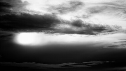 fluffy stormy clouds in black and white, nature background