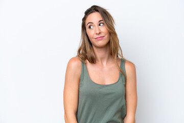 Fototapeta premium Young caucasian woman isolated on white background making doubts gesture looking side