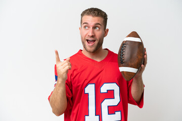 Young caucasian man playing rugby isolated on white background intending to realizes the solution while lifting a finger up