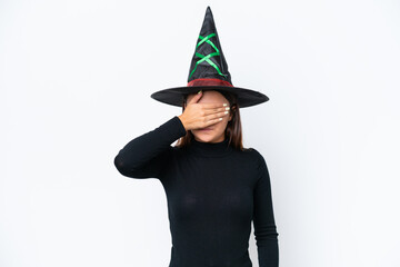 Young caucasian woman costume as witch isolated on white background covering eyes by hands. Do not want to see something